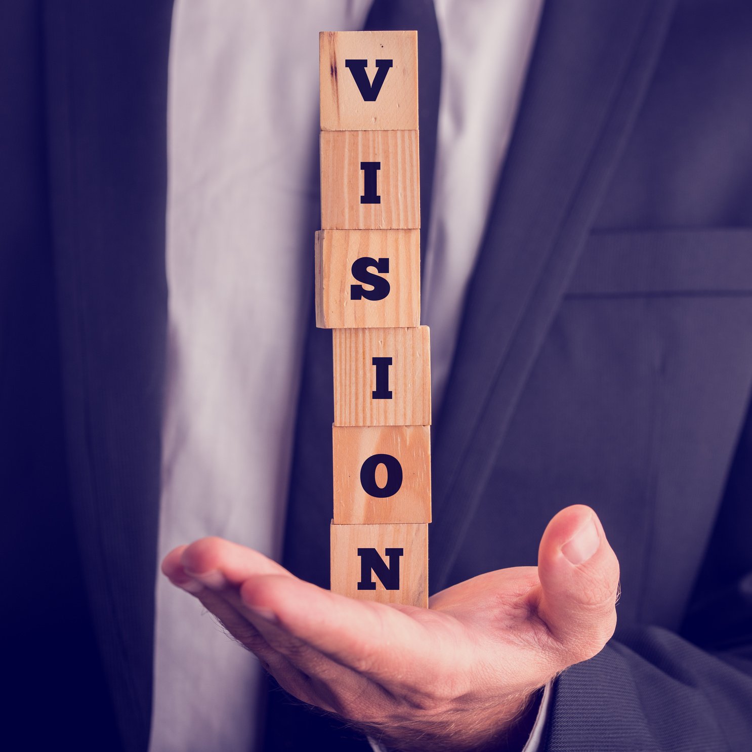 Six Wooden Cubes Spelling the Word Vision